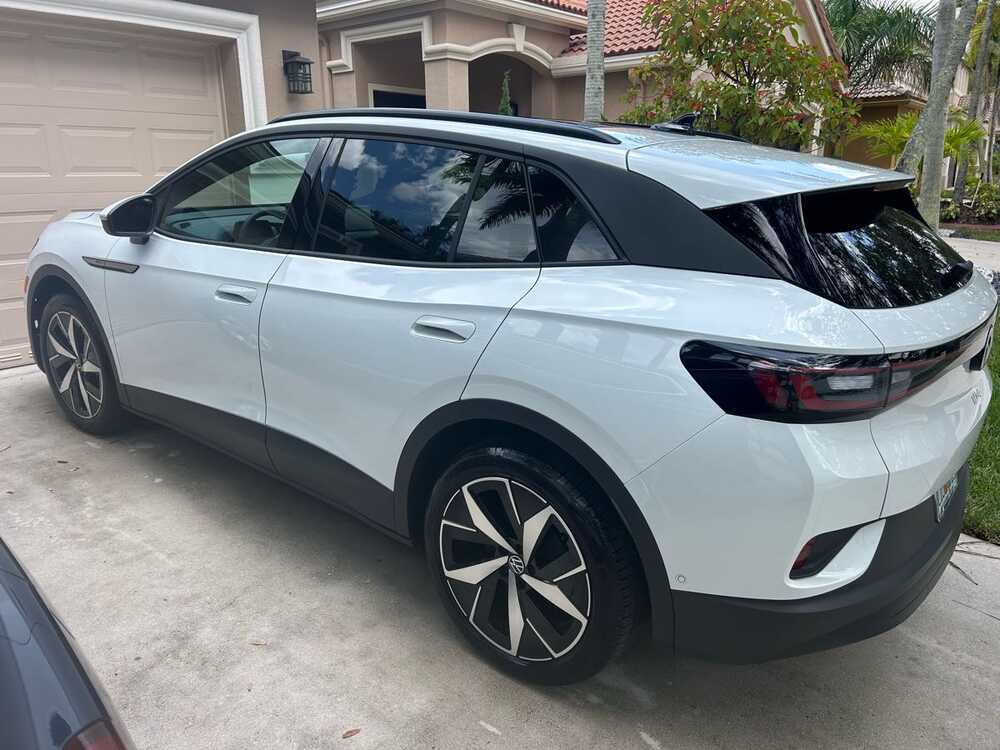 Rear side view of a clean white Volkswagen SUV