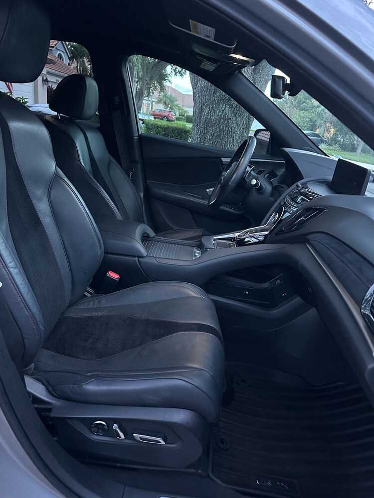 Clean black Acura front seats and dashboard