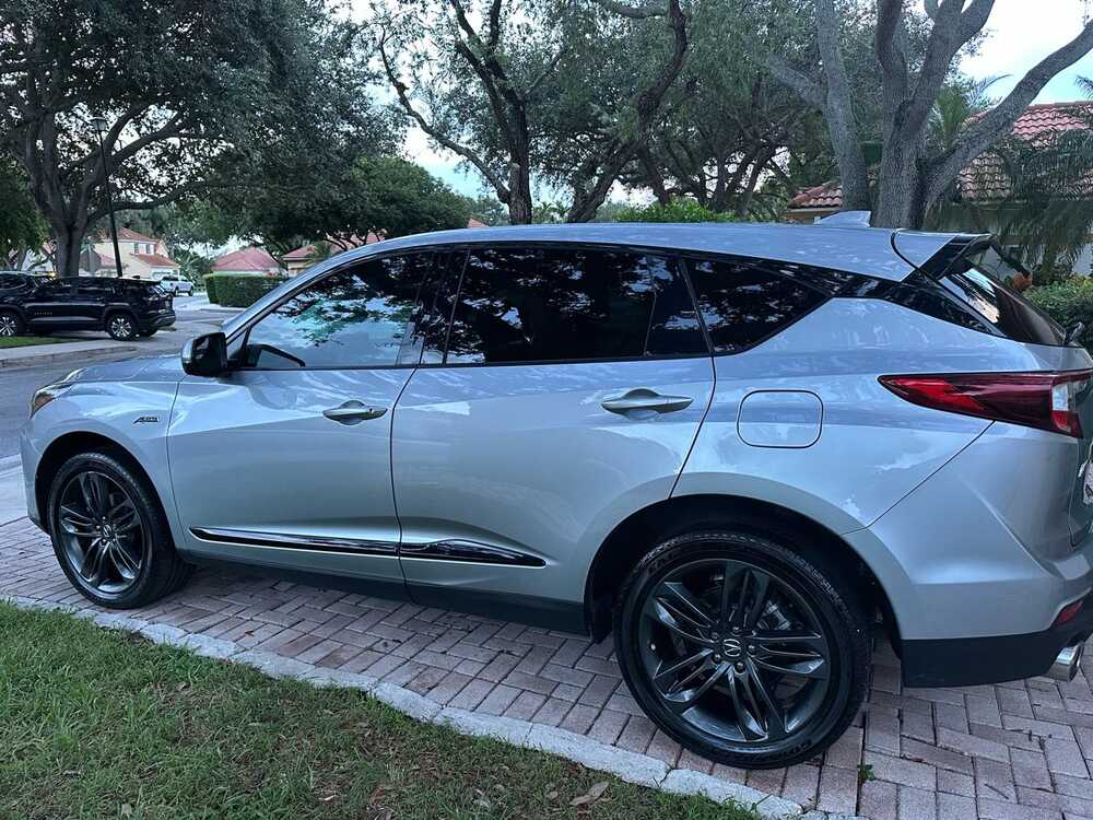 Glossy silver Acura SUV after a mobile detail