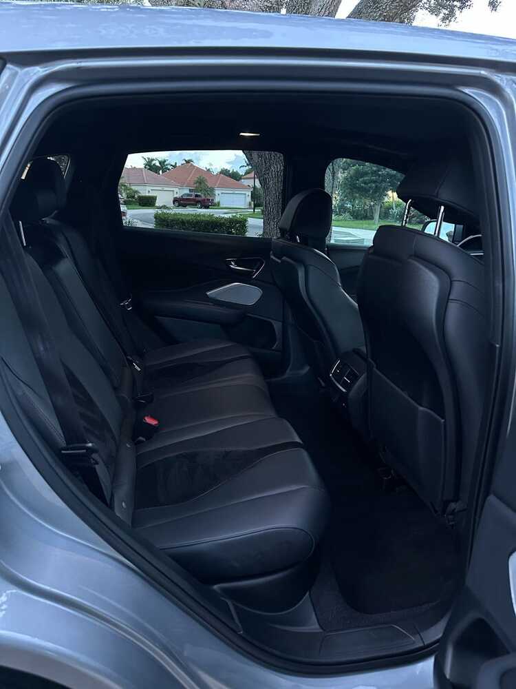 Clean black Acura rear cabin after detailing